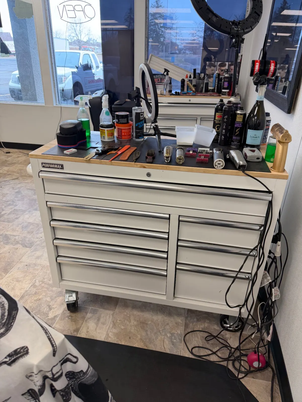 Barber station with clippers, combs, and products